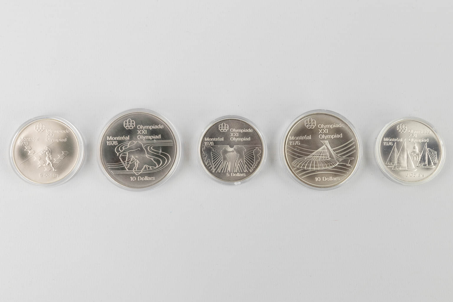 Canadian Olympic Silver Coins 1976, for the Olympic games in Montreal. +/- 1 kg. (D:23 x W:40 x H:4 cm)