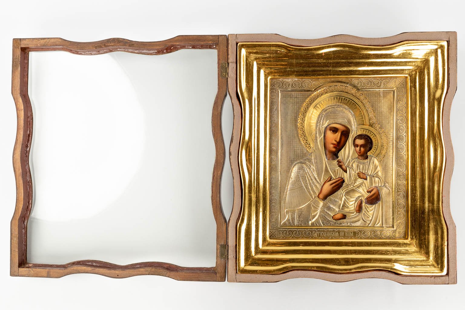 An antique Icon, an Image of Madonna with a child, silver overlay. Saint Petersburg, 19th C. (W: 40,5 x H: 45 cm)
