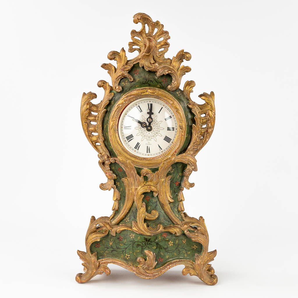 A wood-sculptured table clock in Louis XV style. (W: 25 x H: 46 cm)