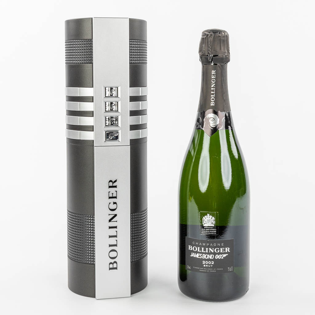 Lot 098 A bottle of Bollinger Champagne in a silencer container, special edition for James Bond, 2002. (H:33cm)
