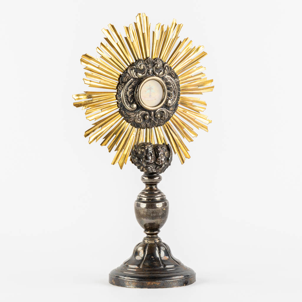 A small sunburst monstrance with a relic for the 