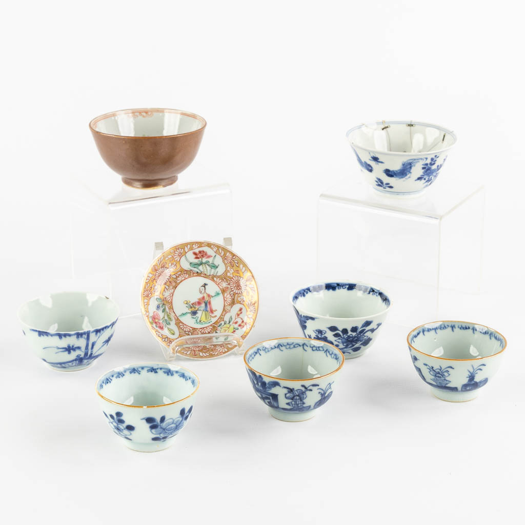 Lot 001 Seven cups and a saucer, Chinese porcelain, Kangxi, Yongzheng and Qianlong period. 18th C. (H:4,5 x D:8,7 cm)