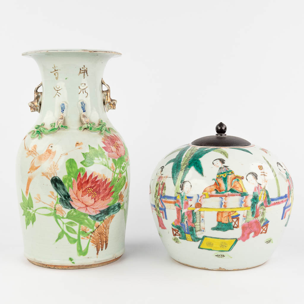  A Chinese vase and a jar with a lid, decorated with fauna and flora and ladies. 19th/20th C. 