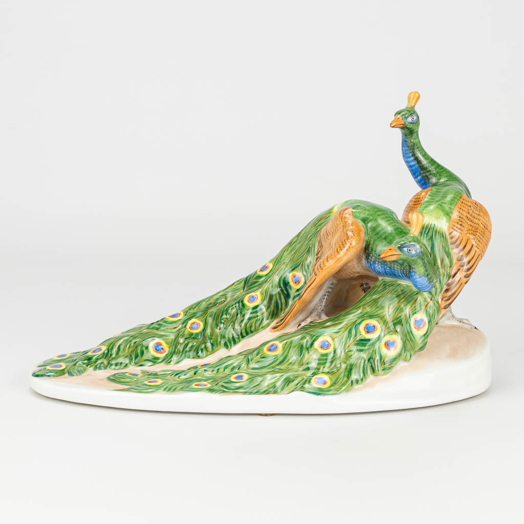 A figurine of peacocks with hand-painted decor and marked Herend, Hungary.