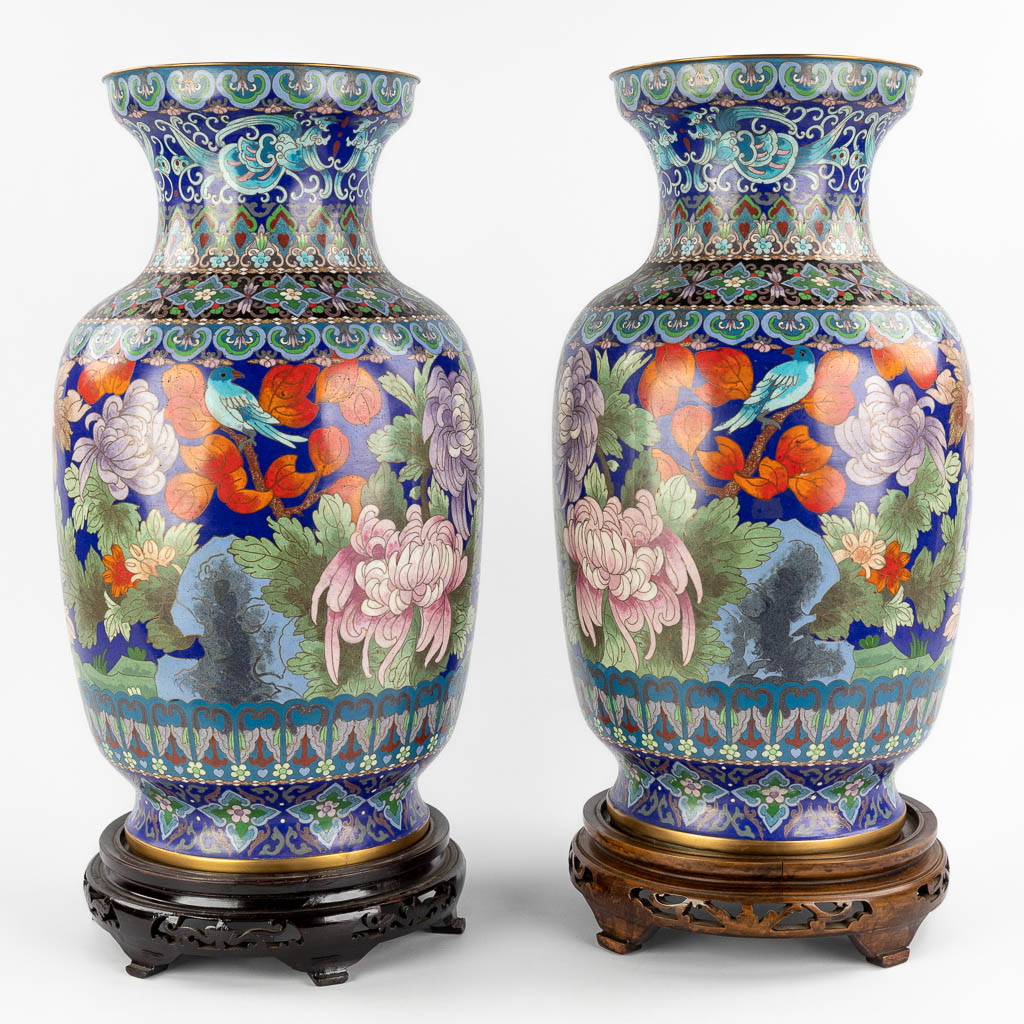 A pair of large cloisonné vases decorated with fauna and flora. 20th C. (H:51 x D:28 cm)
