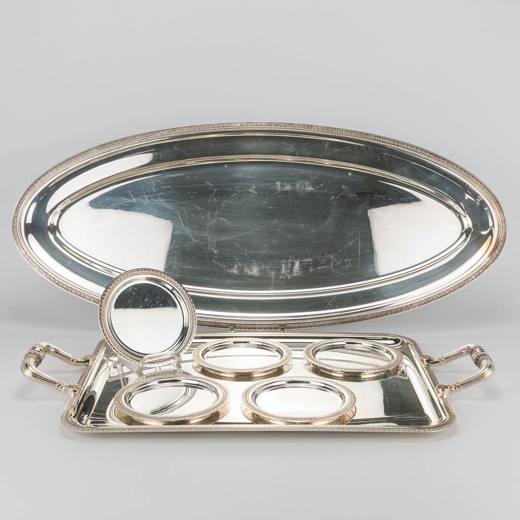 An assembled collection of Christofle silver-plated platters and serving trays of the model 'Malmaison'. 