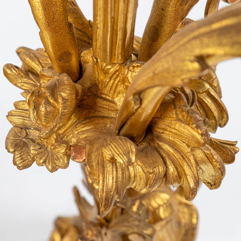 A fine three-piece mantle garniture, gilt bronze, reclined lady, man and candelabra with putti, 19th C. (D:18 x W:72 x H:49 cm)