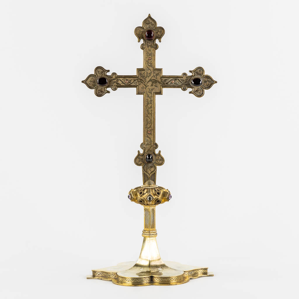  An antique crucifix, Brass with natural stone cabochons and glass, Gothic Revival. 