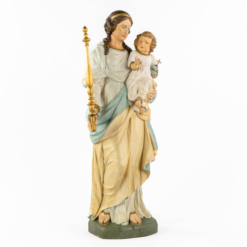A 'Madonna with child' wood-sculptured and patinated wood. 19th C. (L:19 x W:28 x H:77 cm)
