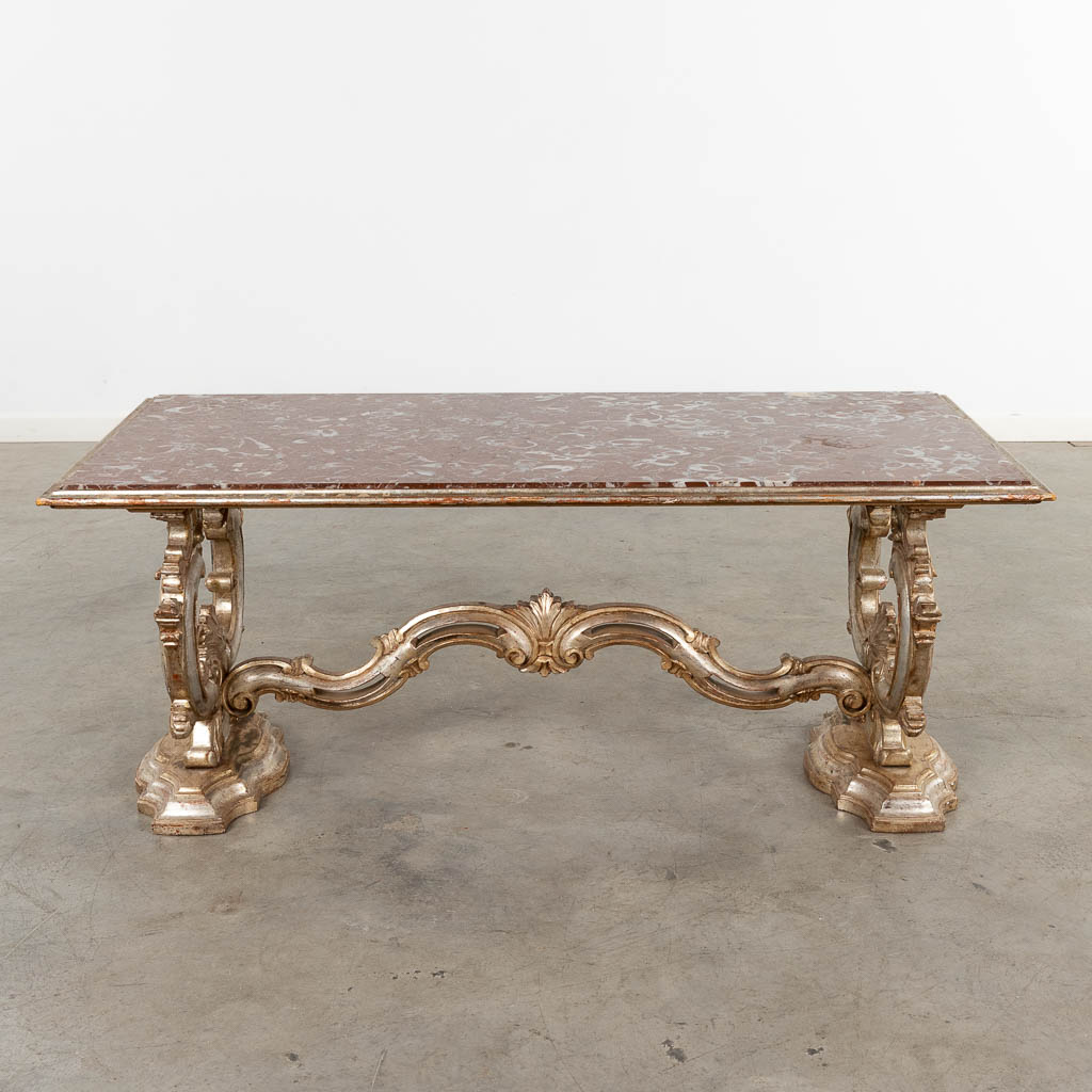 An Italian coffee table with a red marble top. 20th C. (D:62 x W:123 x H:51 cm)