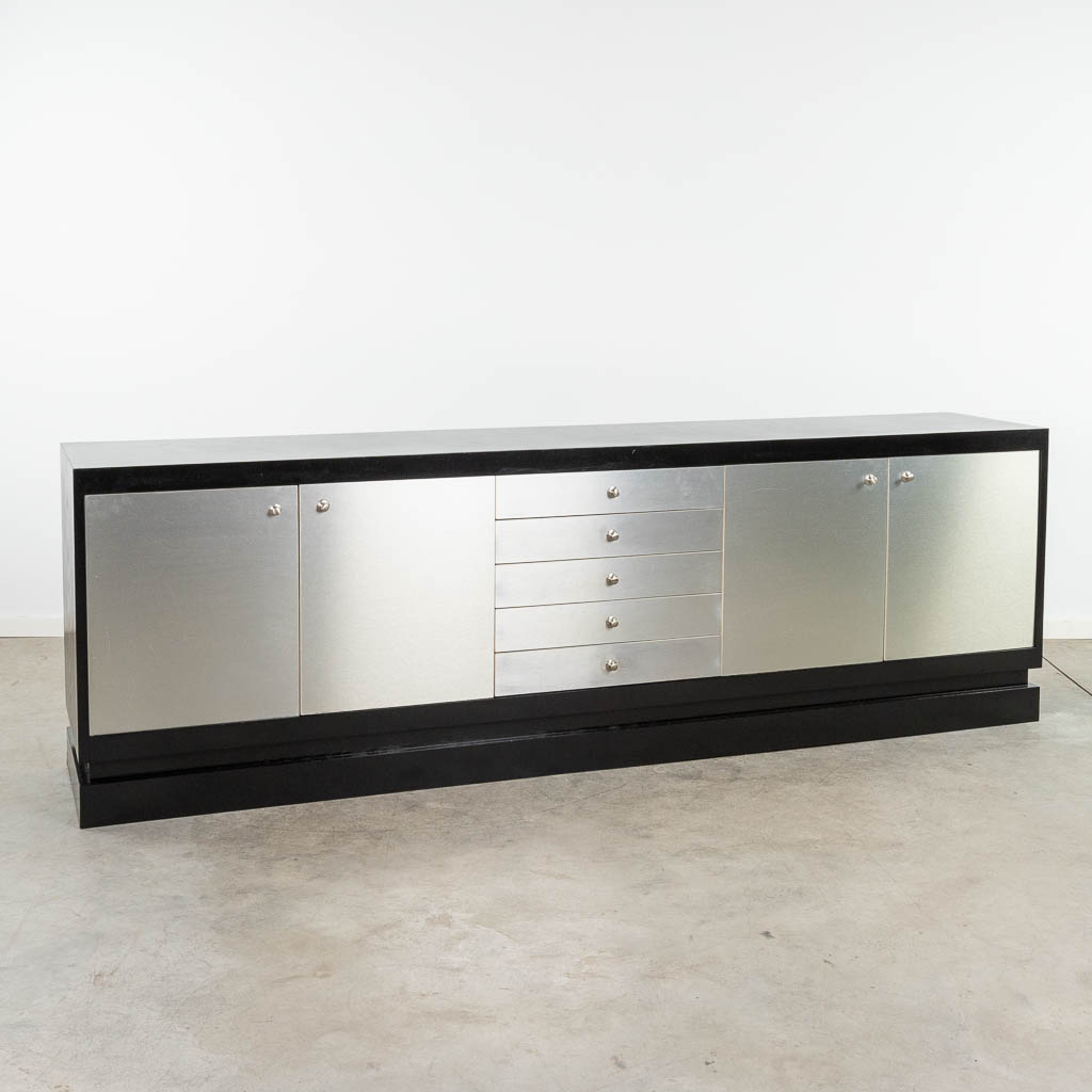  DeCoene, a large sideboard finished with polished metal. Circa 1970.  (L:50 x W:261 x H:83 cm)