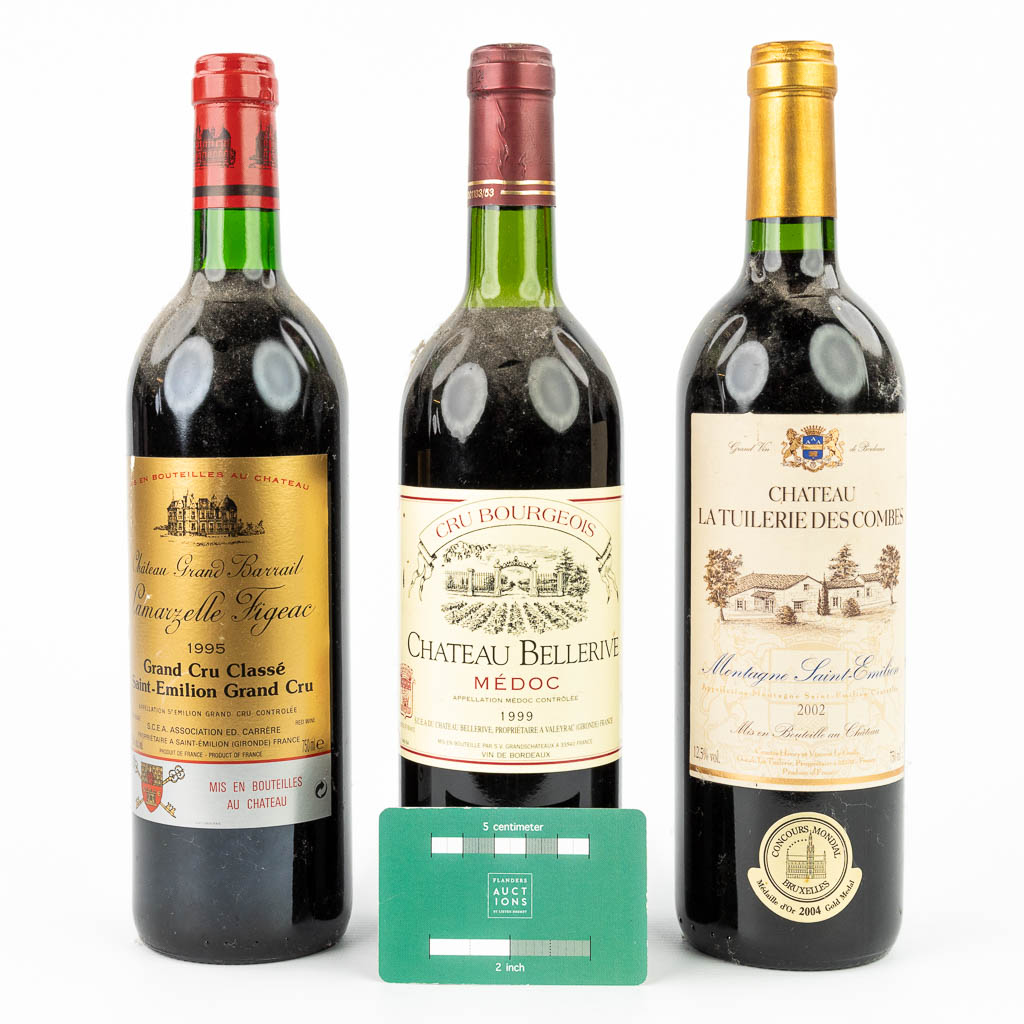 A collection of 3 bottles of red wine. 