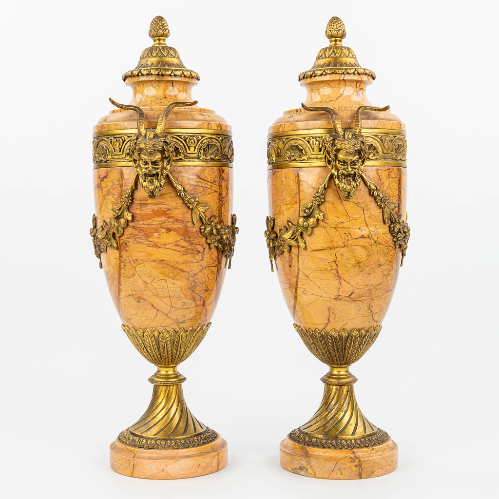 A pair of marble cassolettes mounted with gilt bronze. (H:48,5cm)