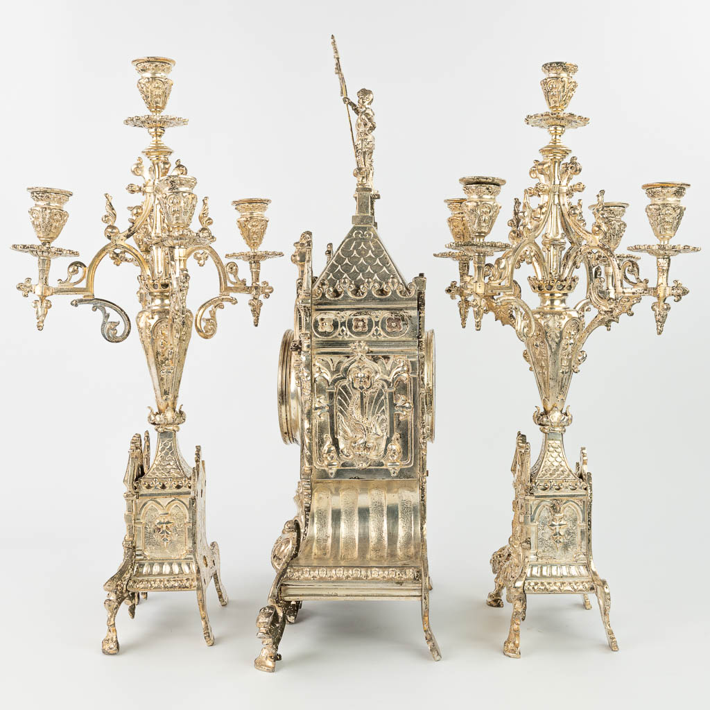 A three-piece garniture clock with candelabra, made of silver-plated bronze in gothic revival style. (H:62cm)