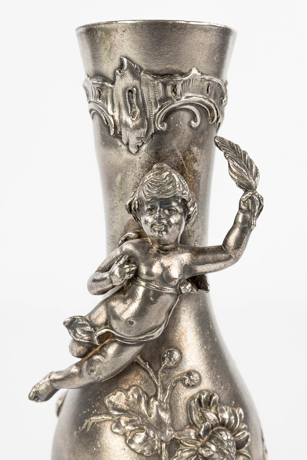 A vase decorated with putti and made of silver-plated metal in art nouveau style. Marked WMF. (H:19cm)