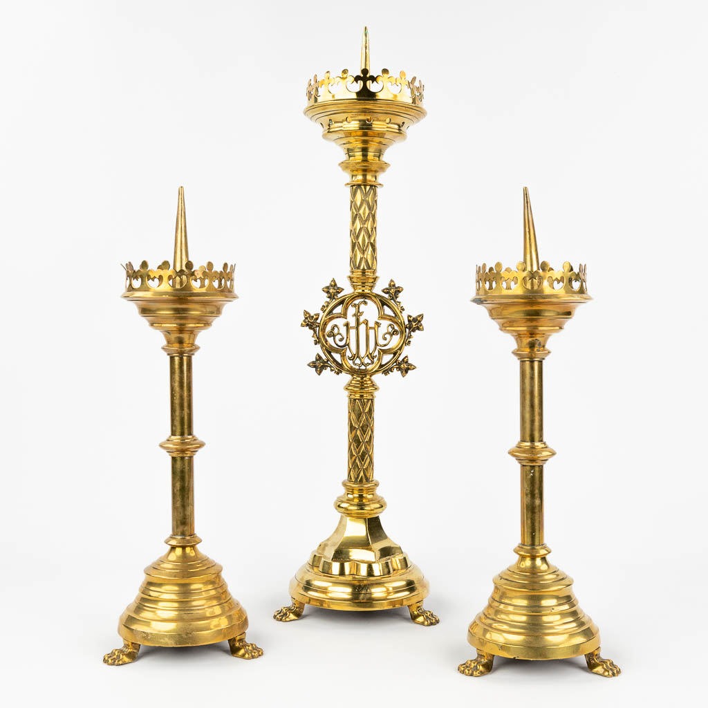 A collection of 3 church candlesticks made in gothic revival style, (H:65 x D:19 cm)