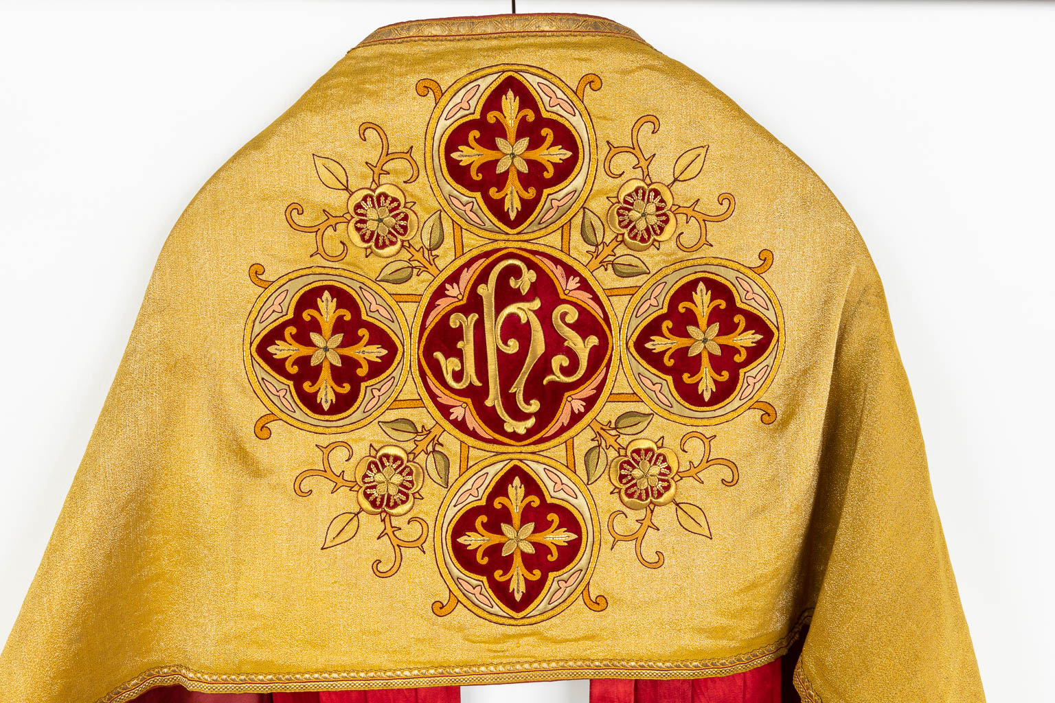 A cope, two humeral veils, a Roman Chasuble, finished with thick gold thread embroideries.