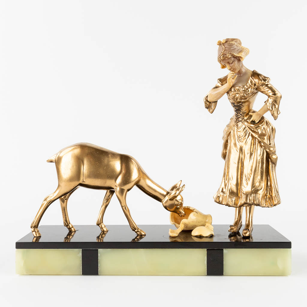  Lady and a deer, a statue made in art deco style. Spelter and marble.  (L:11 x W:33 x H:30 cm)