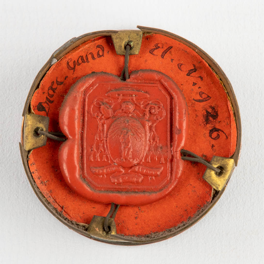 A sealed theca with a relic: Ex Ossibus Sancti Aratoris Martyris