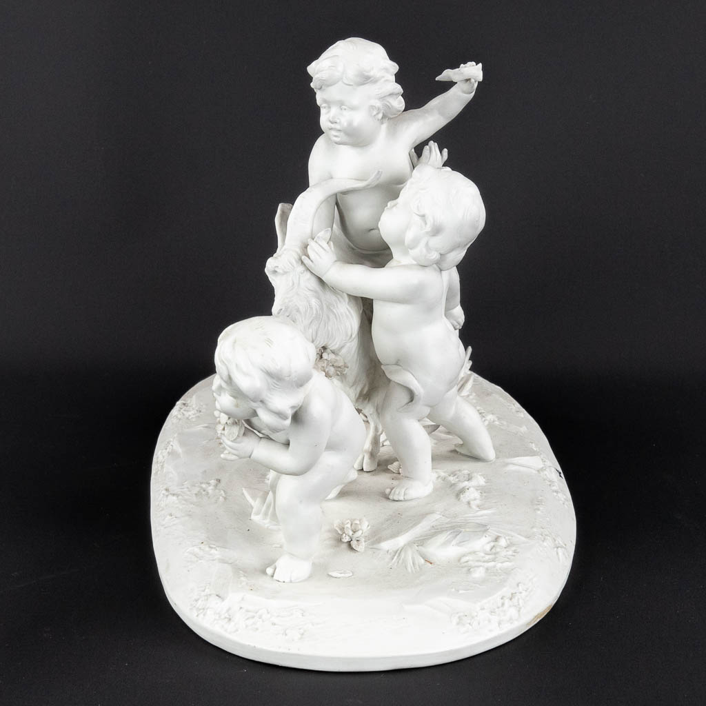 Rudolstadt Volkstedt, a porcelain group of putti with a Ram. (D:19 x W:36 x H:22 cm)