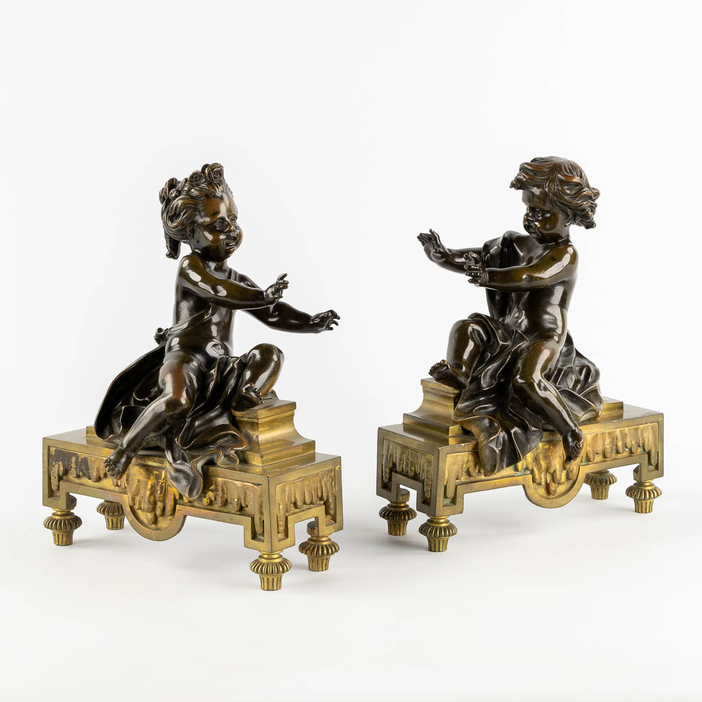 Lot 027 A pair of fireplace bucks, gilt and patinated bronze with boy and girl, 19th C. (L:13 x W:24 x H:31 cm)