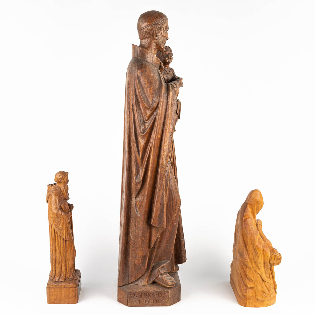 A collection of 3 statues of holy figurines made of sculptured wood. (H:78cm)