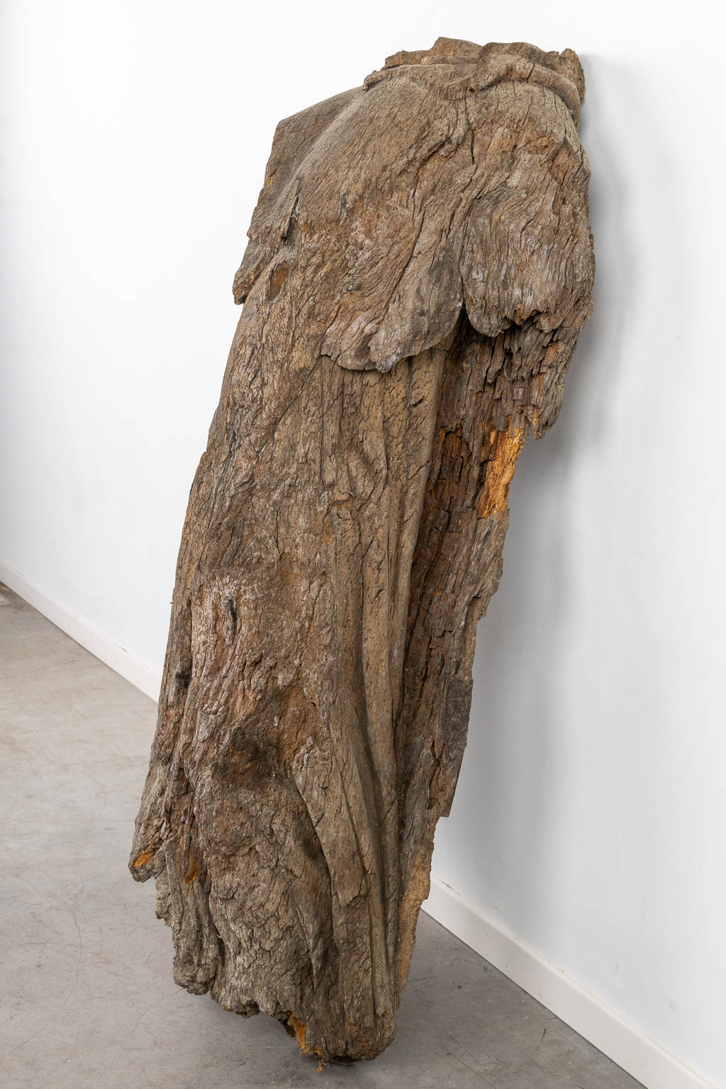 The antique remains of a wood sculptured angel or saint, 16th/17th C. (L:38 x W:63 x H:147 cm)