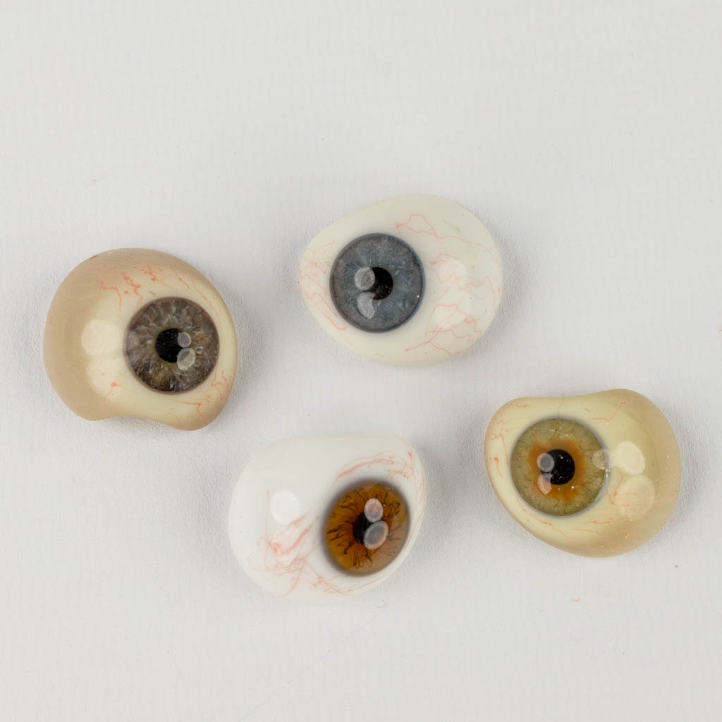 A large collection of glass prosthetic eyes, 73 pieces. Circa 1900. (L:23 x W:32 x H:6 cm)