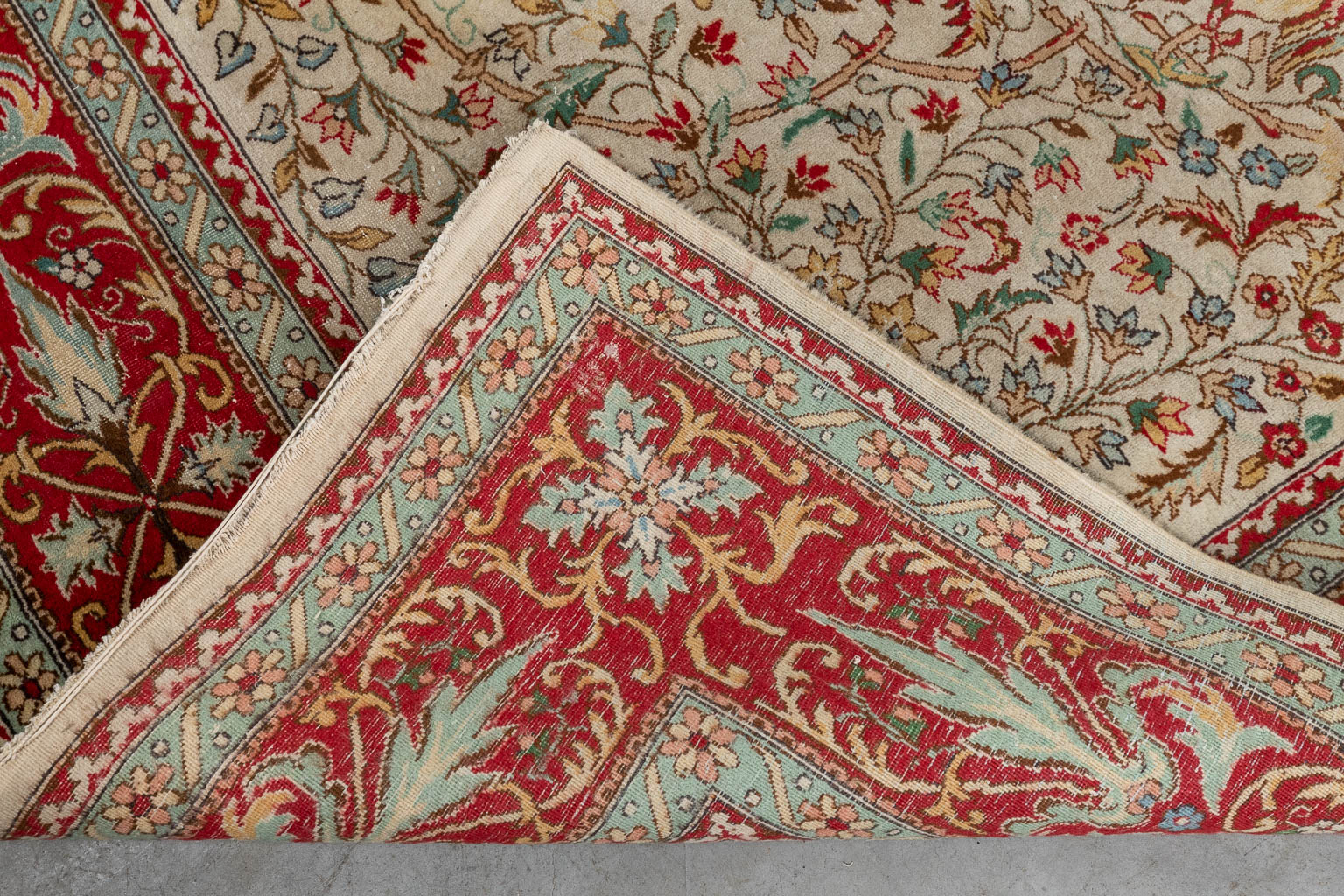 An Oriental hand-made carpet, Tabriz. (D:354 x W:254 cm)