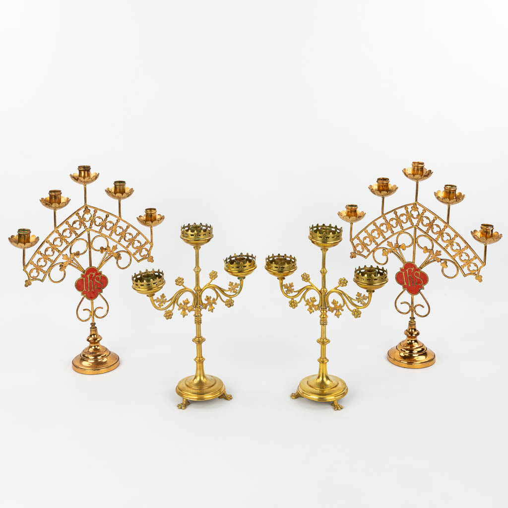 A collection of 2 pairs of candlesticks in neogothic style. (H:43cm)