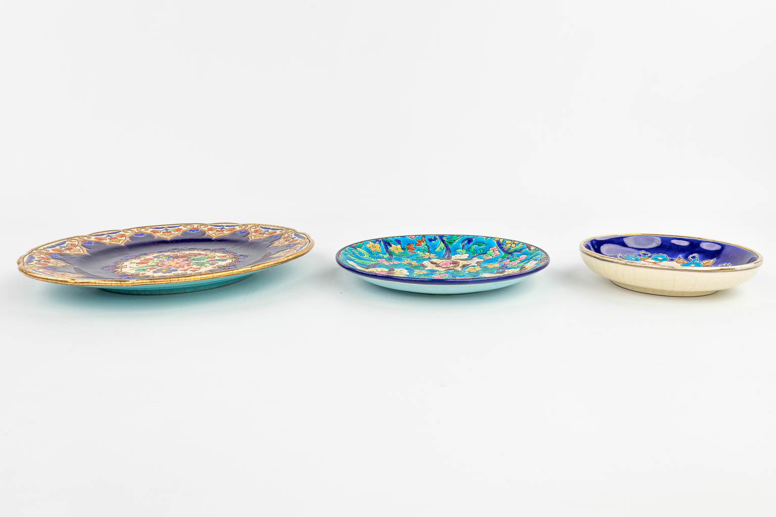 A collection of 15 items made of ceramics by Longwy and in the style of Longwy. 