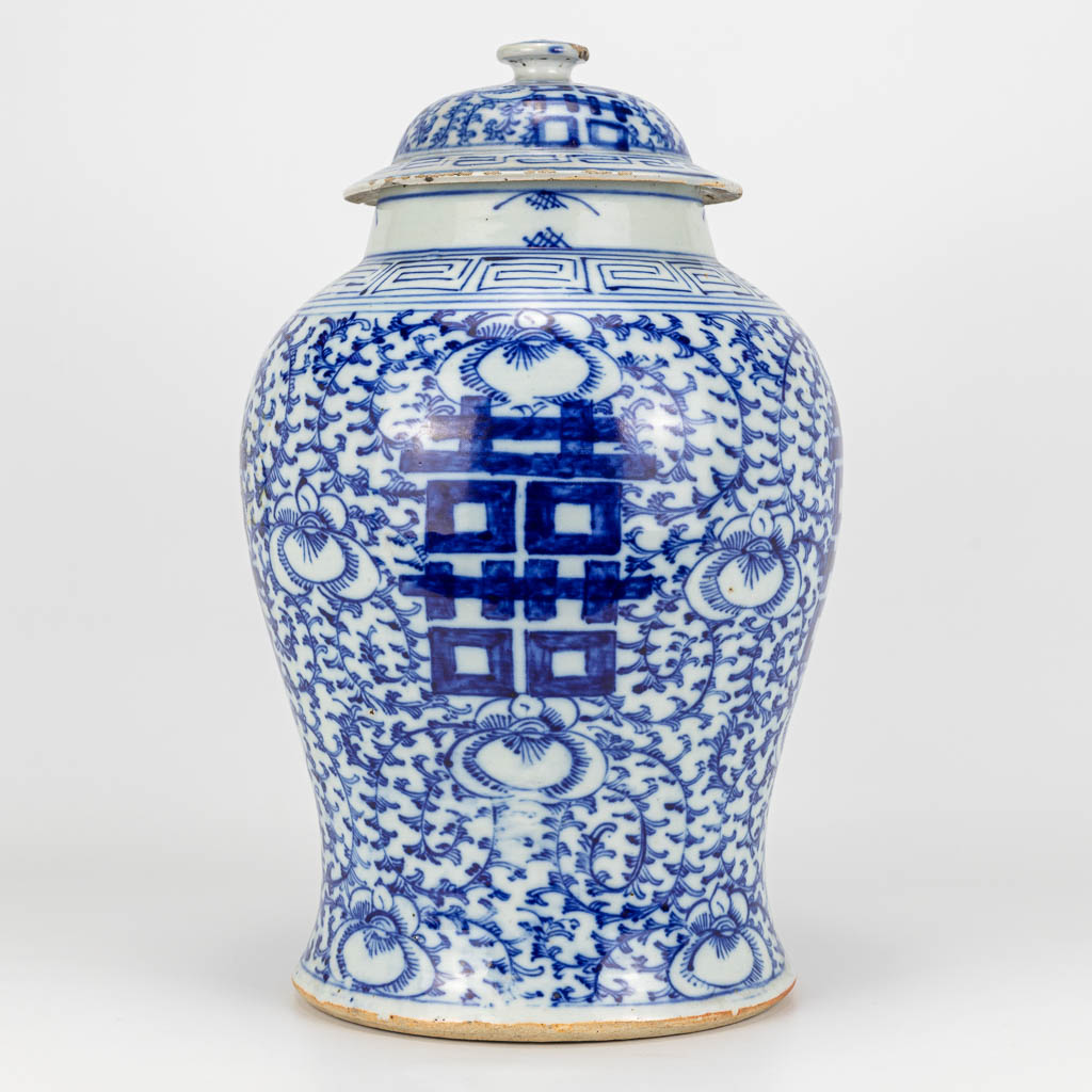 A vase with a cover made of Chinese porcelain and decorated with a blue-white decor double Xi symbols of happiness. (H:41cm)