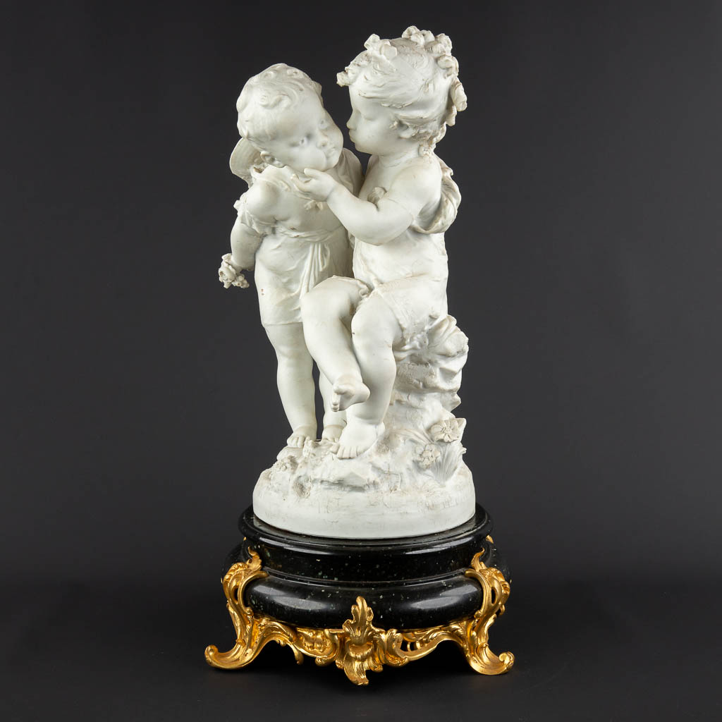 Auguste MOREAU (1834-1917) 'Two Children' bisque porcelain. (H:58 x D:35 cm)