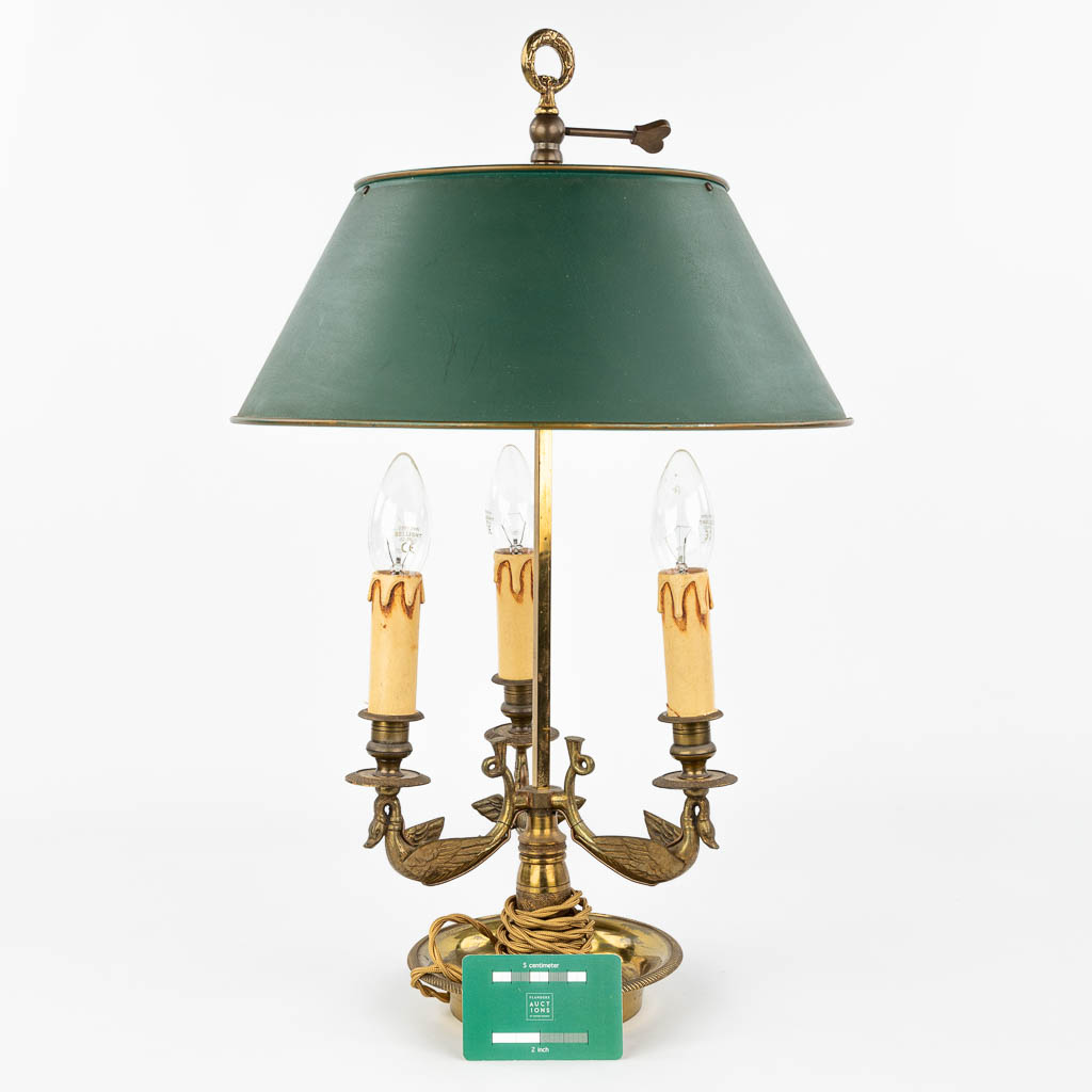 A table lamp made of bronze and decorated with swans in Empire style. (H:56cm)