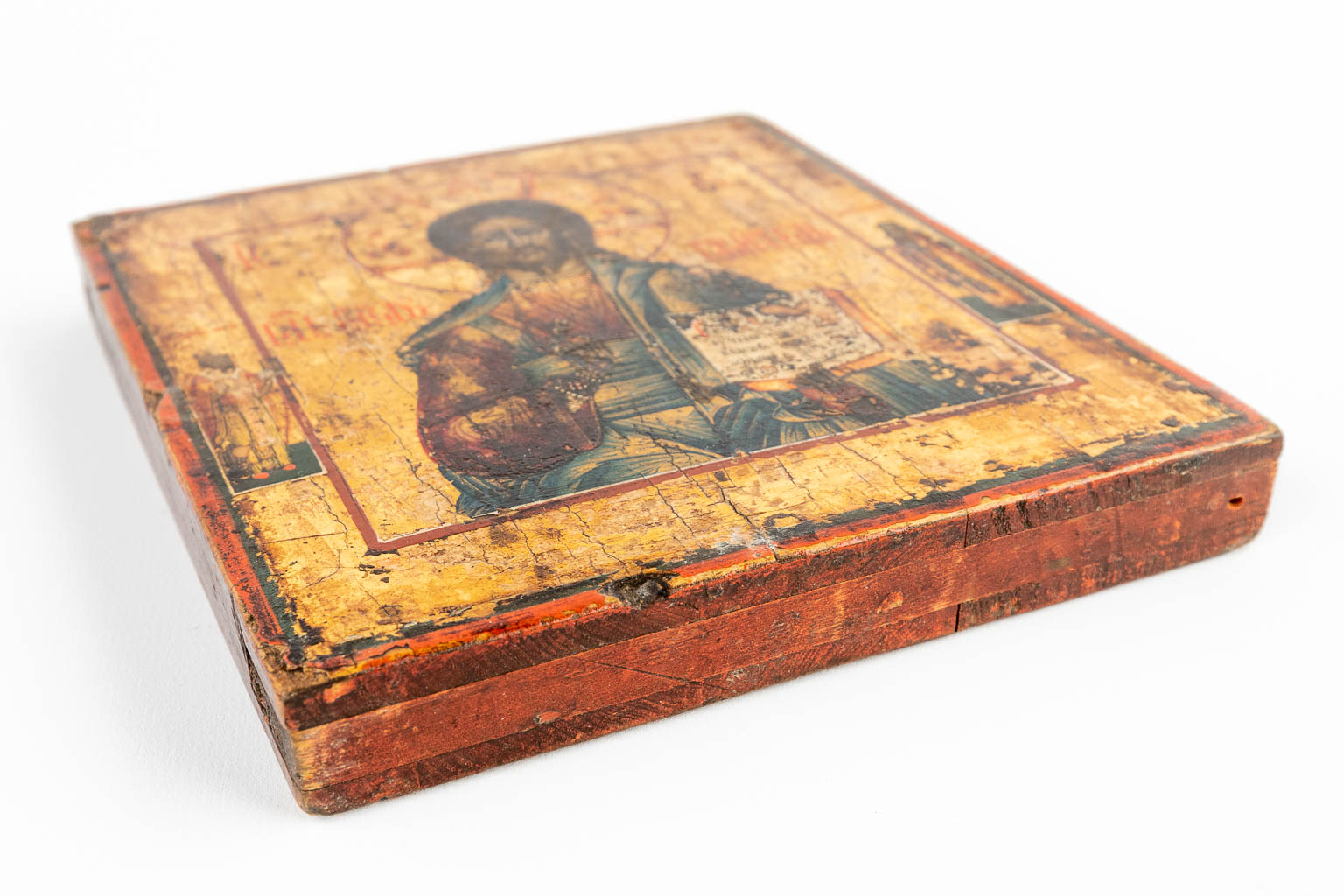 A small Eastern European icon of Jesus Christ, mounted in a gilt frame. 19th C. (W:21,5 x H:25 cm)