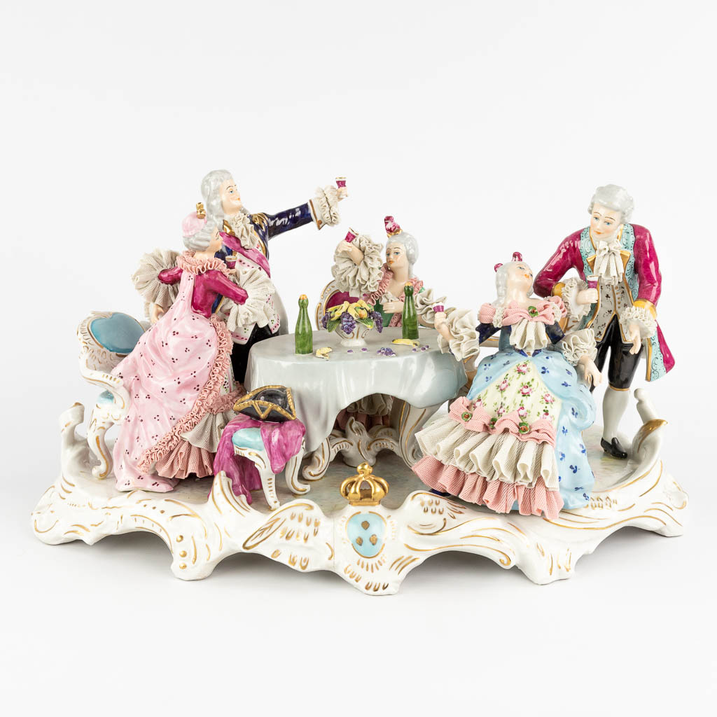 A porcelain group 'The Dinner', Saksony porcelain. 20th C. (D:32 x W:53 x H:28 cm)