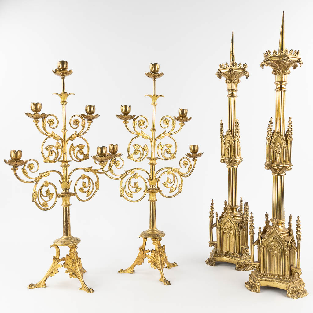  A collection of 2 pairs of Church candlesticks and candelabra. Circa 1900. 