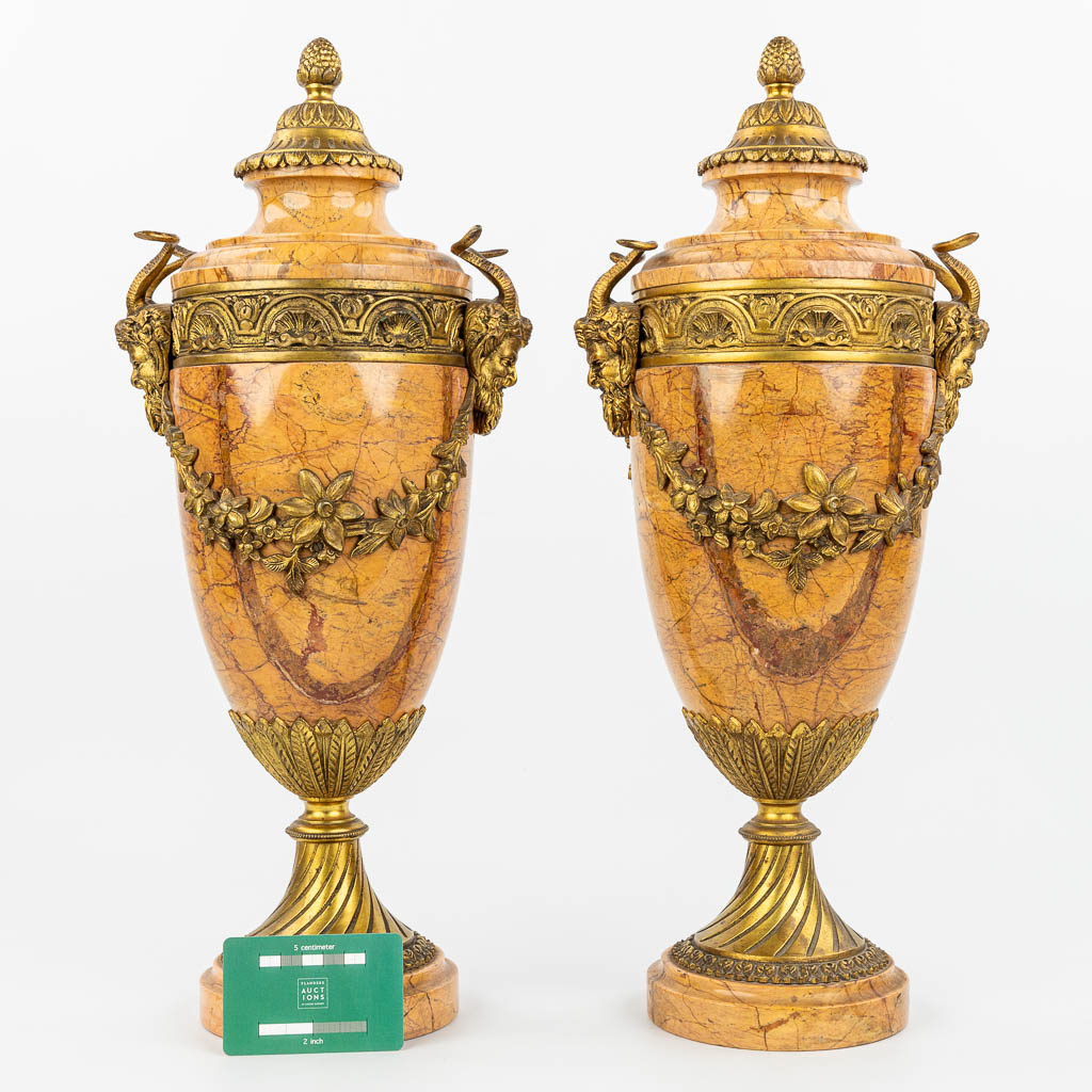 A pair of marble cassolettes mounted with gilt bronze. (H:48,5cm)
