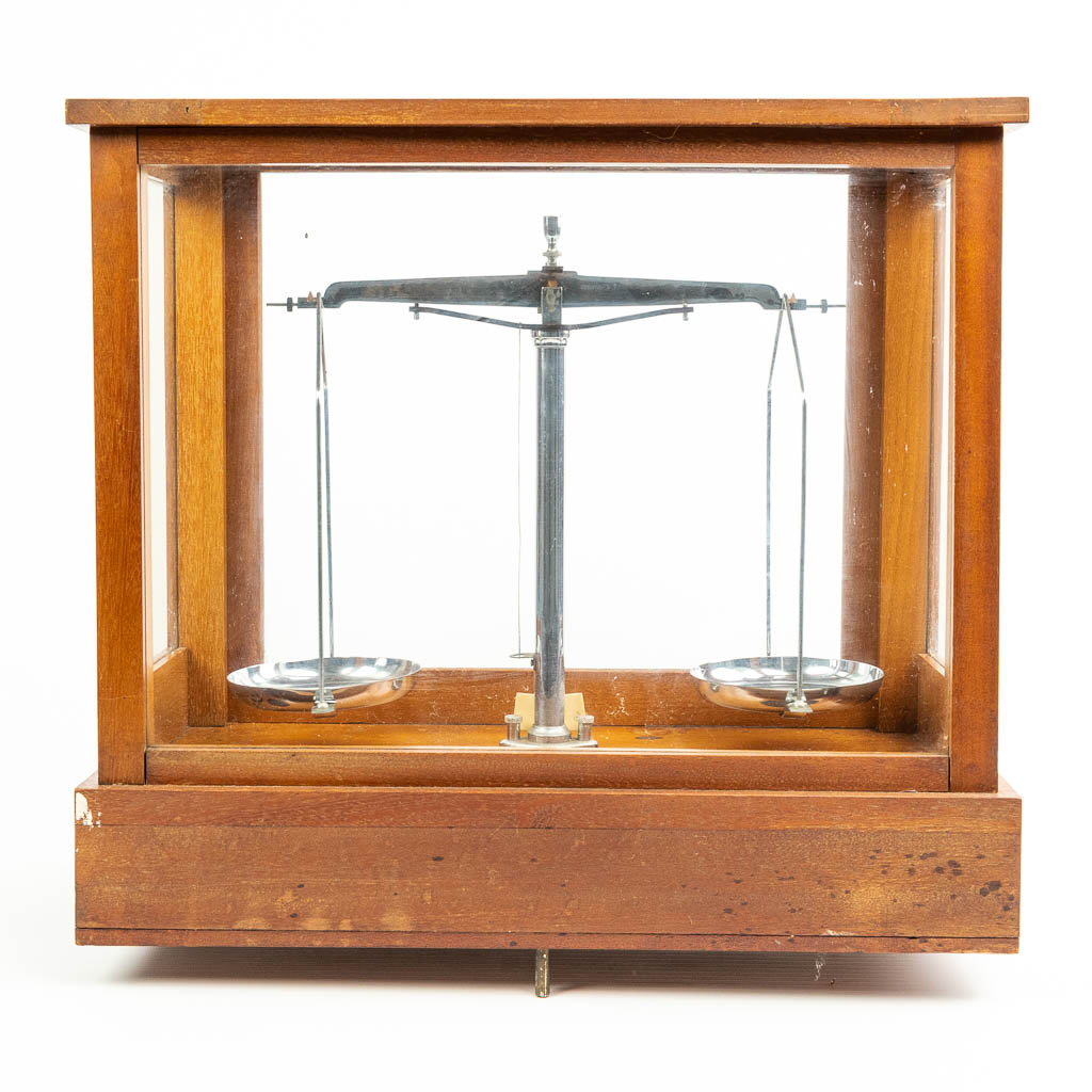 A pharmacy precision scale in a box made of wood and glass and marked A & R Francois Frères, Chatelet Belgique. (H:42cm)