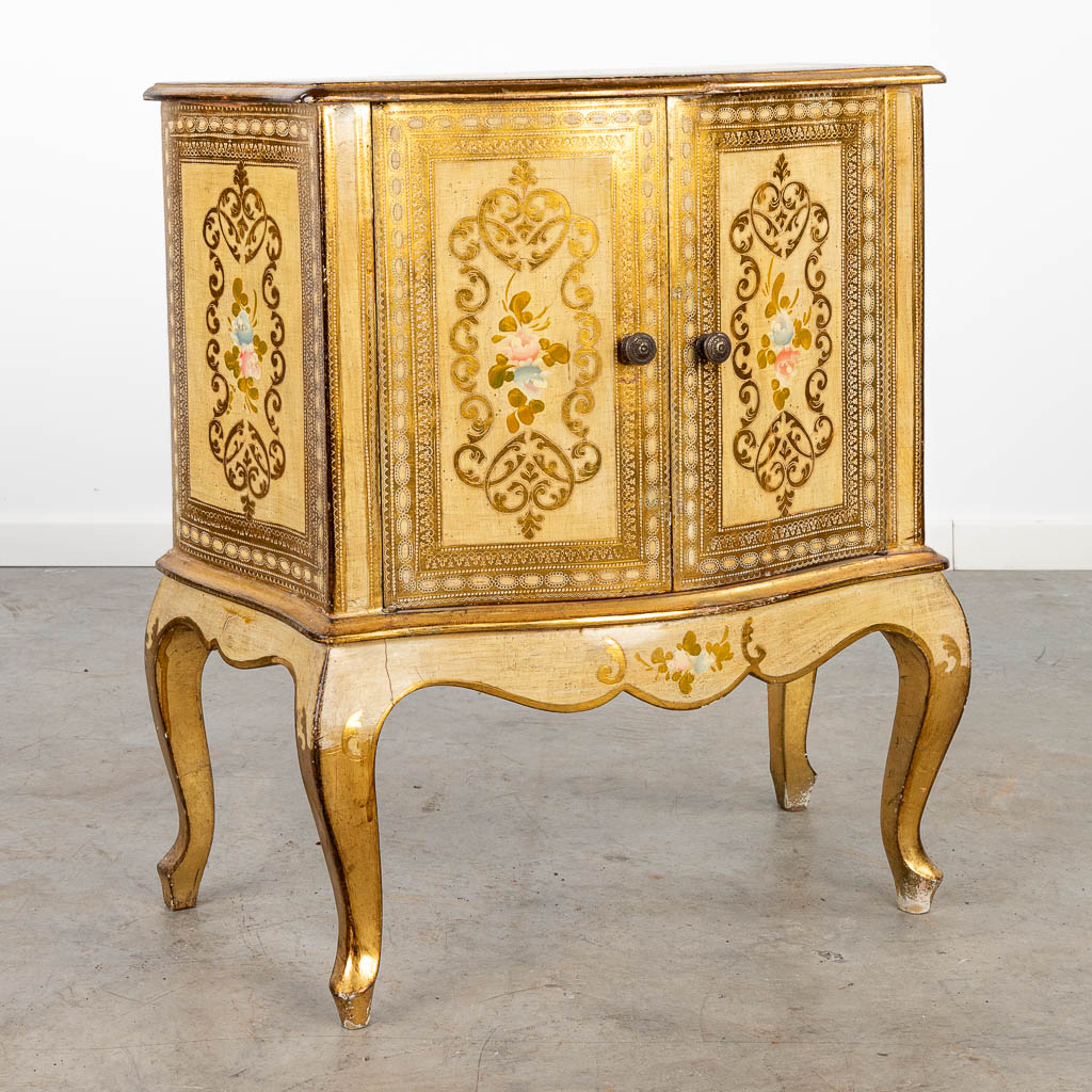 A two-door side cabinet made of gilt wood. (H:73cm)