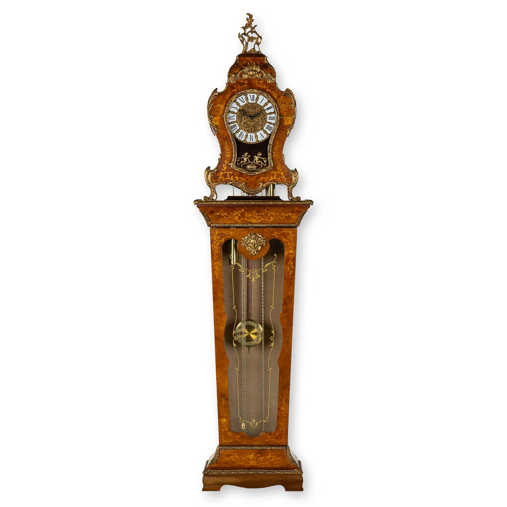  A cartel clock on a pedestal, Westminster movement, marquetry inlay and mounted with bronze. 