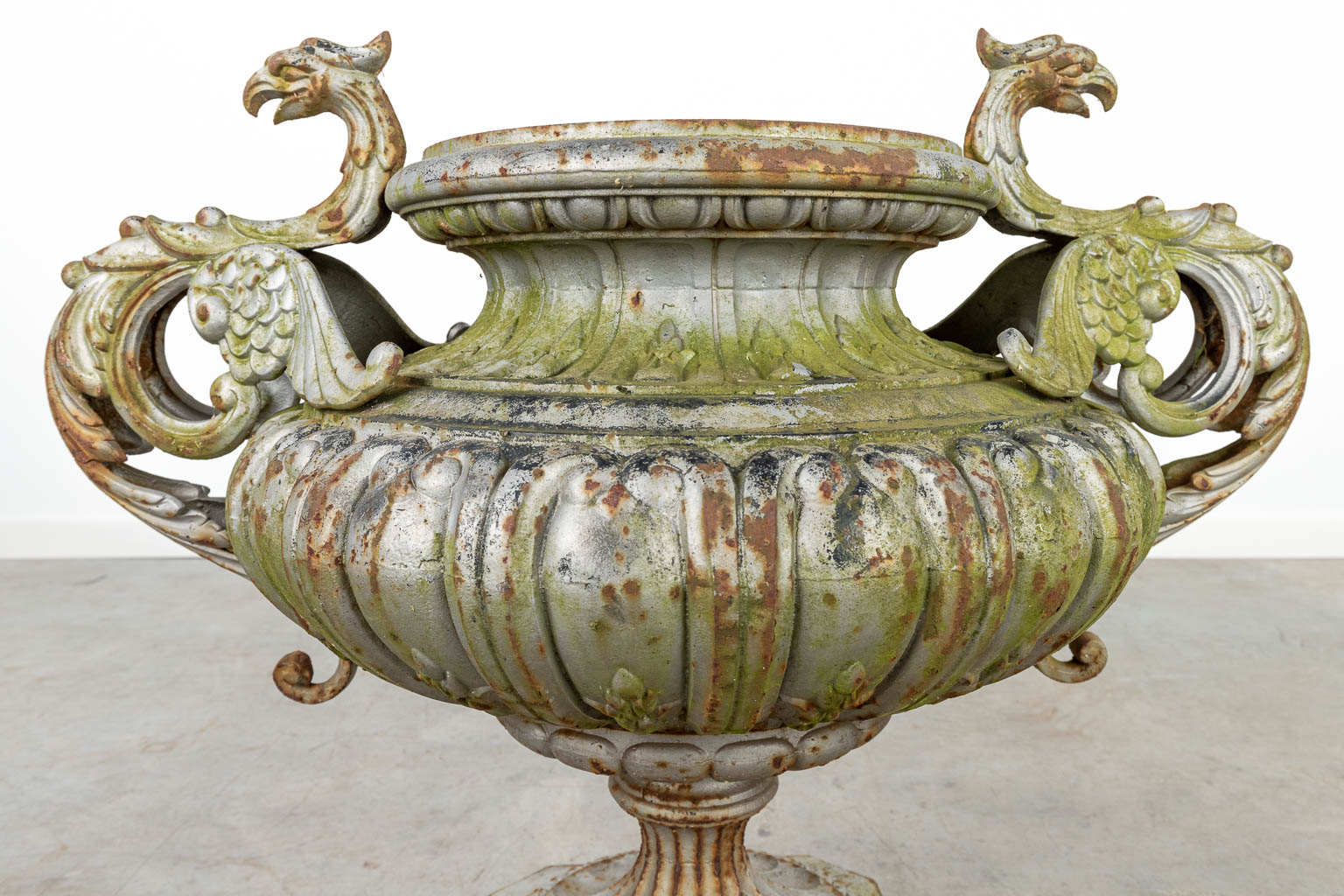 An antique garden vase made of cast iron and decorated with Phoenixes. (H:62cm)