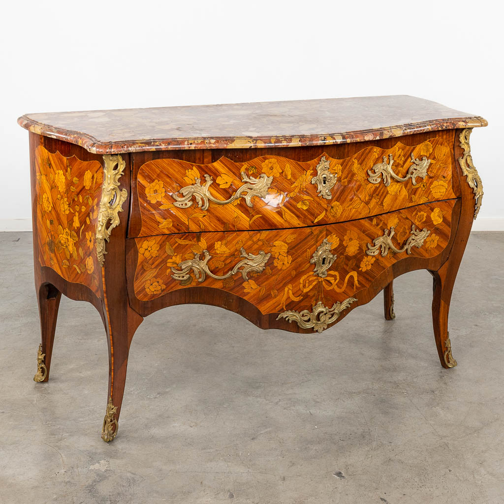  A commode, Louis XV, two drawers with marquetry veneer and mounted with bronze. 18th C. (D:65 x W:145 x H:89 cm)