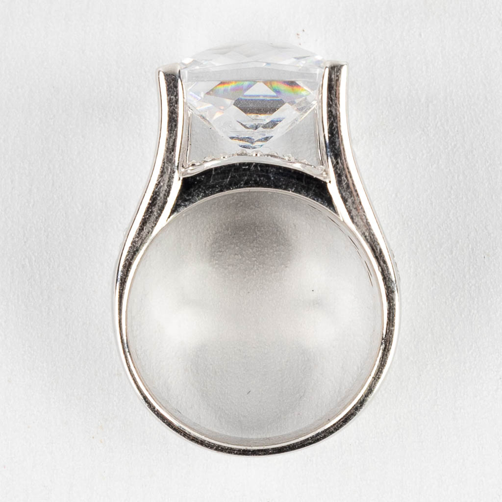 A ring with large square facetted stone/glass and smaller stones/glass. Silver, marked 925.