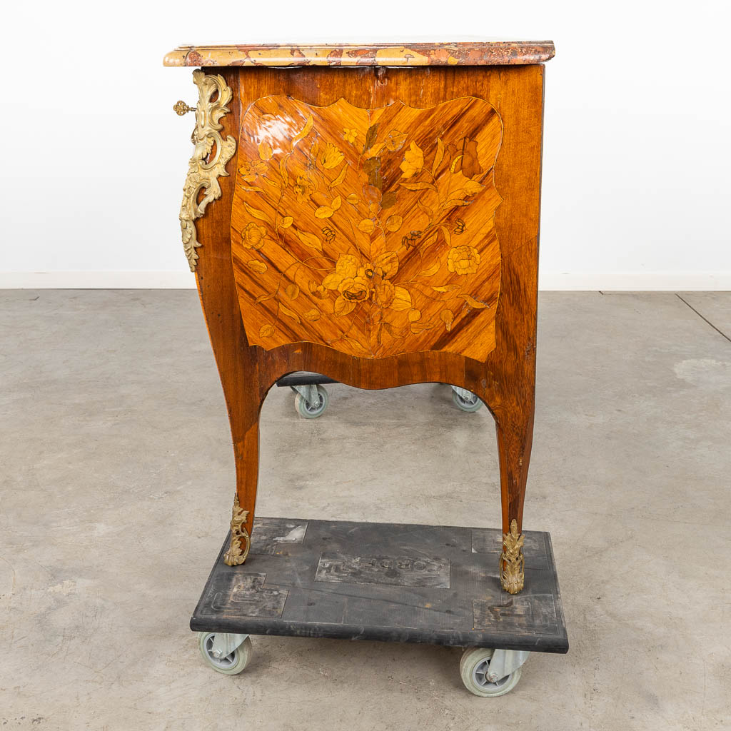 A commode, Louis XV, two drawers with marquetry veneer and mounted with bronze. 18th C. (D:65 x W:145 x H:89 cm)
