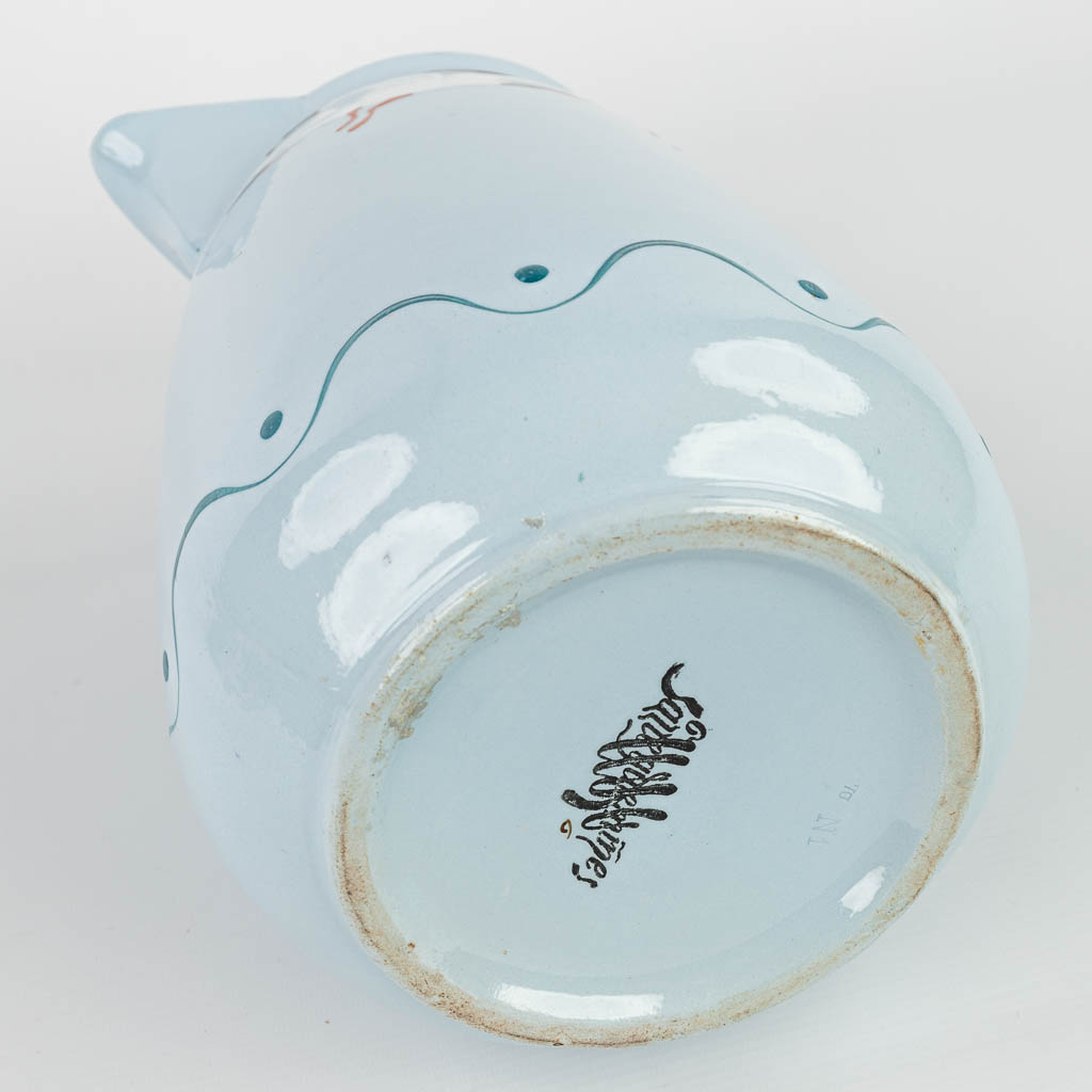 A jug and bowl made in art nouveau style with blue glaze and decorated with seagulls. Marked Sarreguemines. (H:14cm)