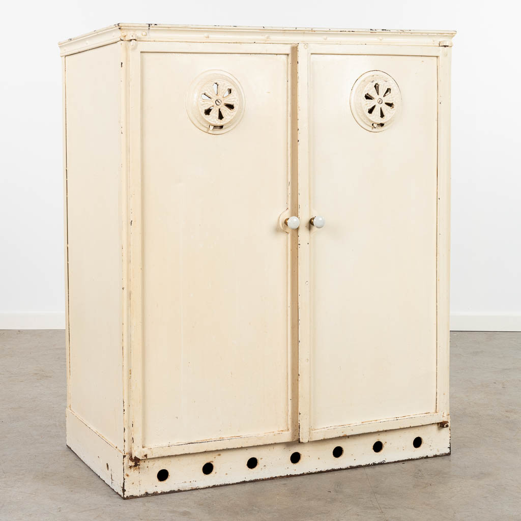 An antique plate warming cabinet made of metal. (H:105cm)