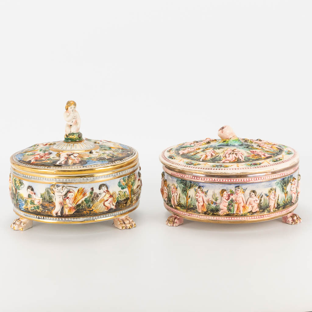 A collection of 2 bonbonnières or candy jars made of hand-painted faience. Capodimonte, Italy. 