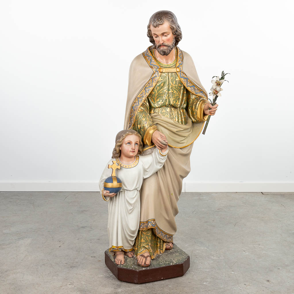 A statue of Joseph and Jesus with a Globus Cruciger made of patinated plaster. (H:110cm)