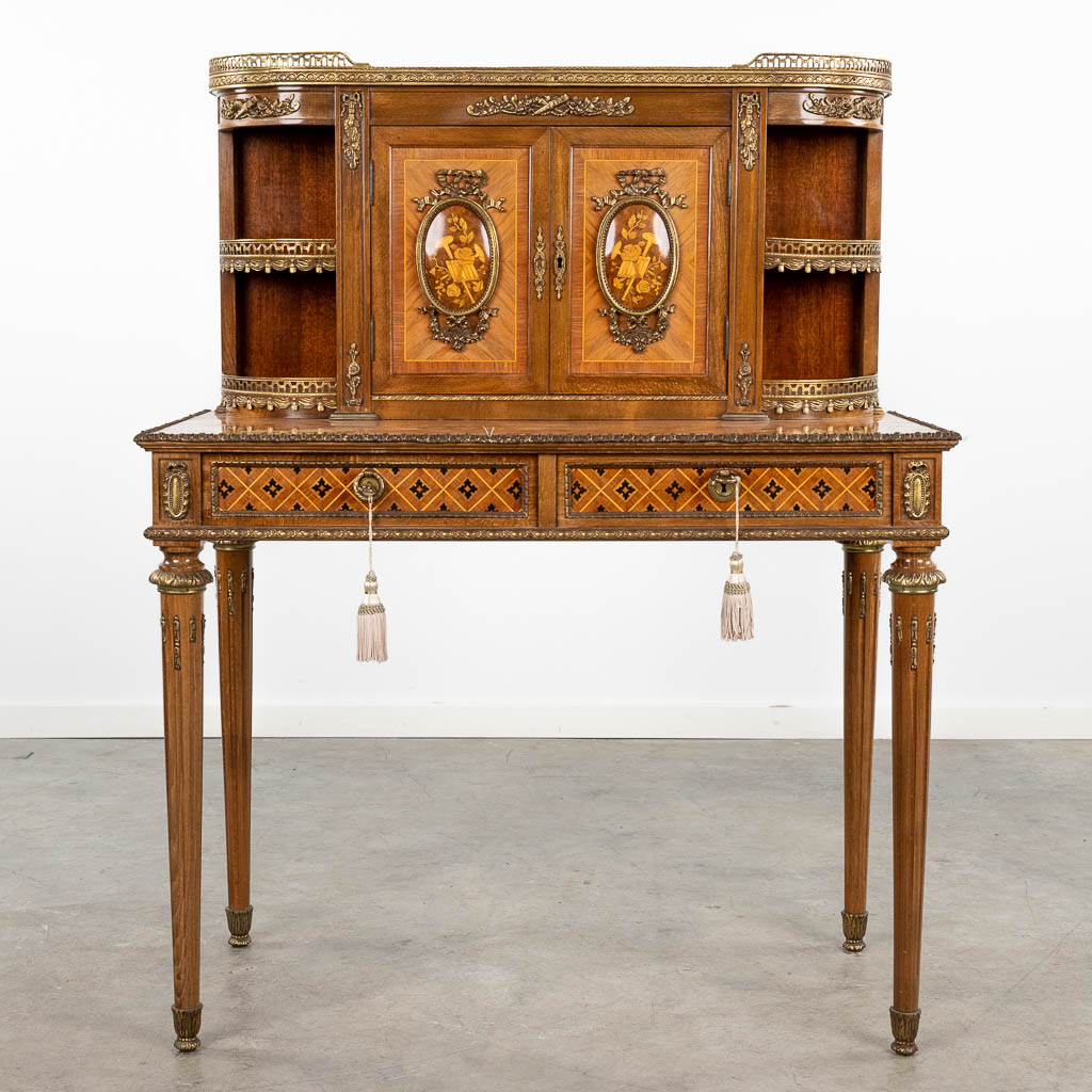 A lady's desk finished with marquetry inlay and mounted with bronze. 20th C. (L: 46 x W: 93 x H: 118 cm)